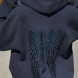 Hættetrøje med hætte og stort vingemotiv med pailletdetaljer på ryggen