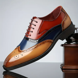 Herre broguesko med wingtip, perforerede detaljer, snørebånd og lav hæl