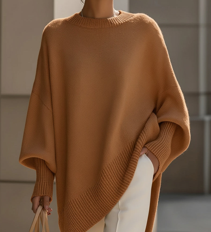 Dame oversize striktrøje med rund hals, lange ærmer og asymmetrisk kant