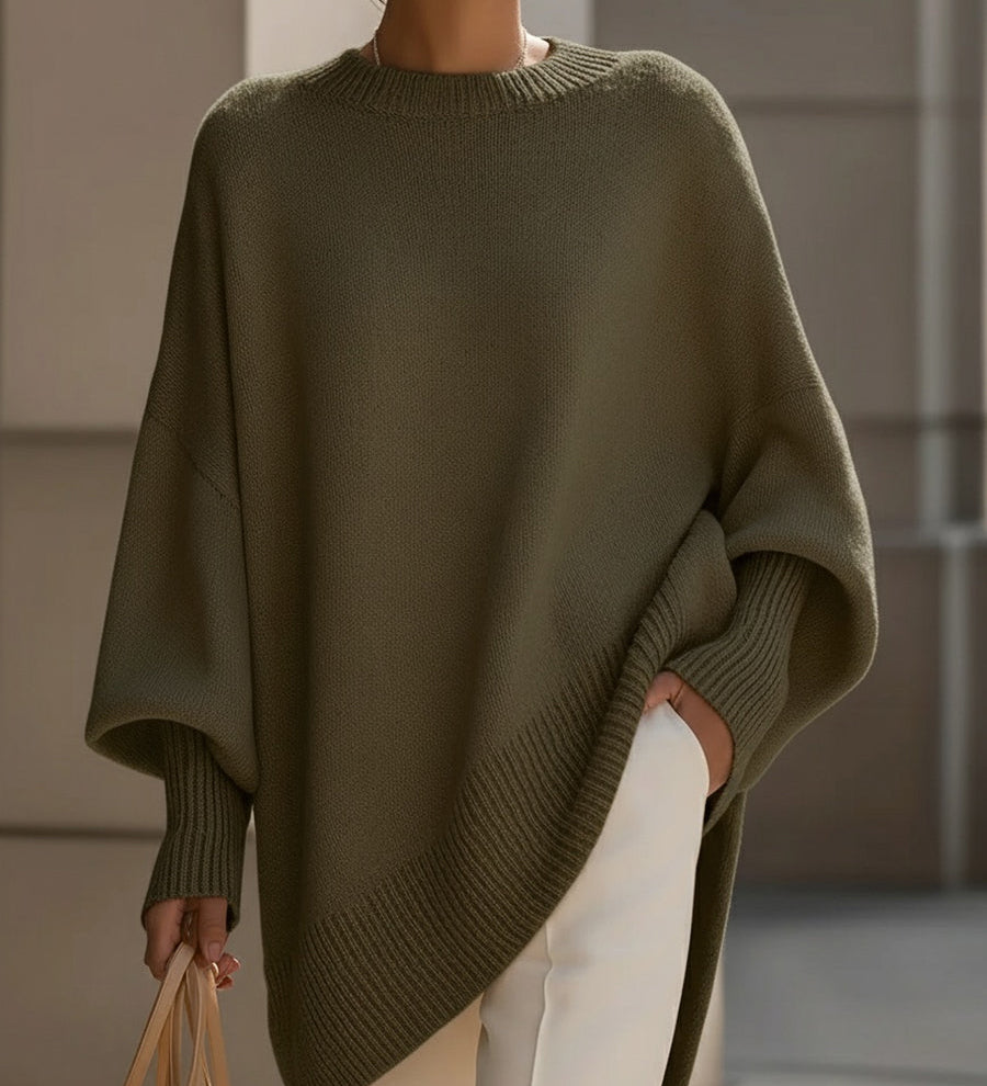 Dame oversize striktrøje med rund hals, lange ærmer og asymmetrisk kant