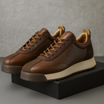 Unisex sneakers med snørebånd, rund tå og strukturerede sidepaneler