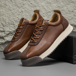 Unisex sneakers med snørebånd, rund tå og strukturerede sidepaneler
